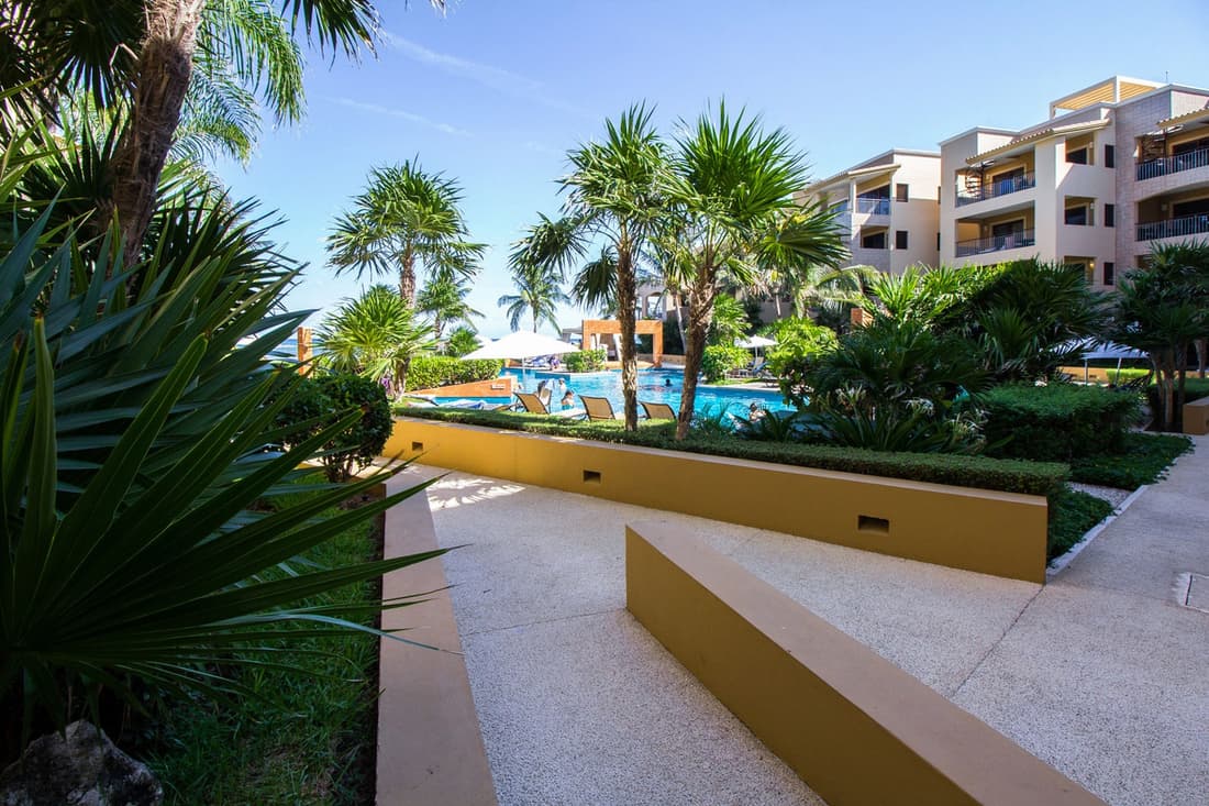 Ground floor, luxury 2 bedroom condo with pool view at El Faro by DPM