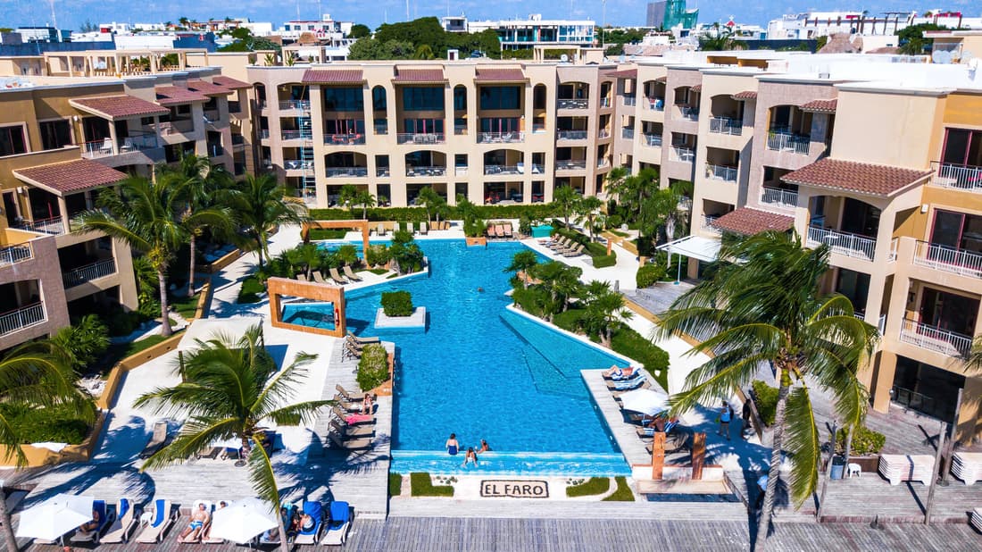 Ground floor, luxury 2 bedroom condo with pool view at El Faro by DPM