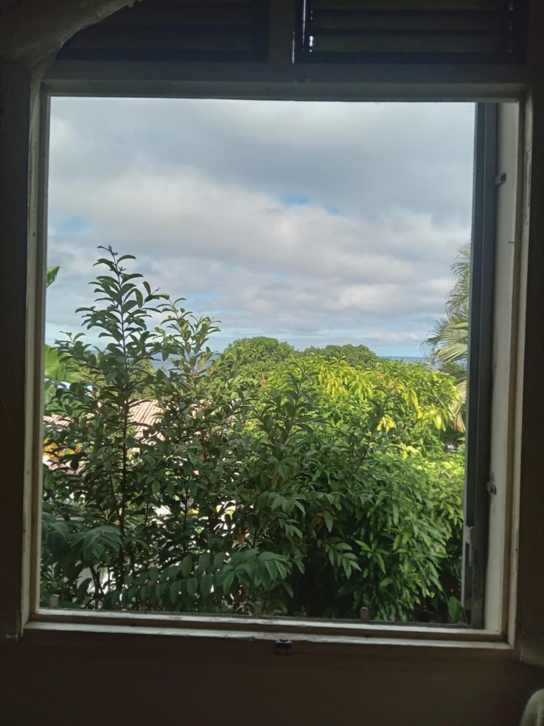 Large bedroom in a private host house with shared bathroom, garden, veranda, and private parking