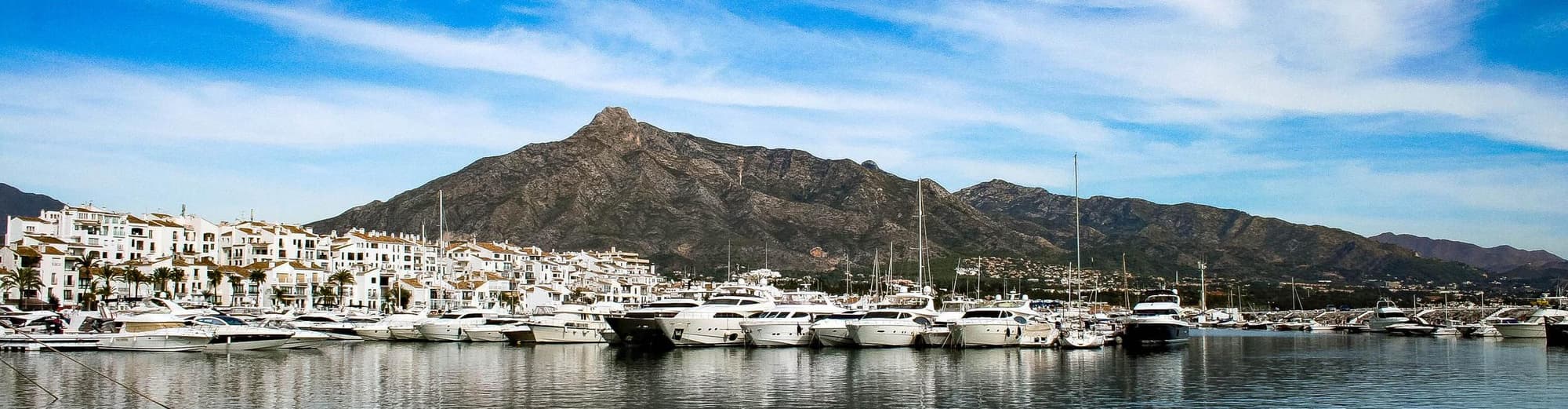 Πουέρτο Μπανούς, Ισπανία