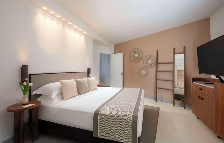Baia di Chia Resort Sardinia, Curio Collection by Hilton